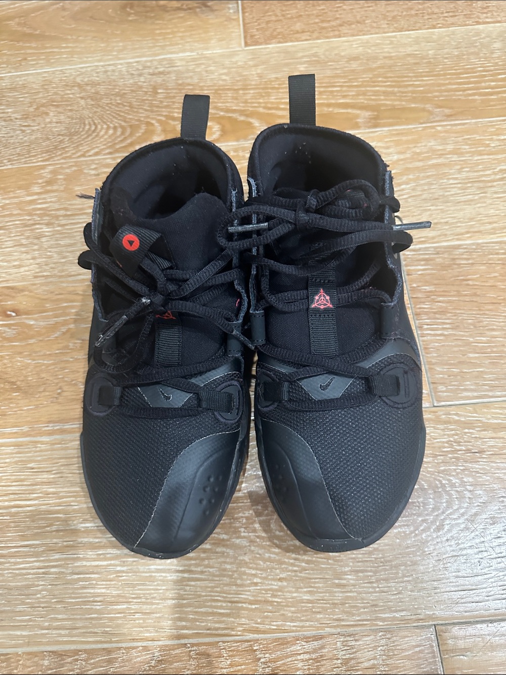 Nike Kids Black Sneakers with Small Red Accents